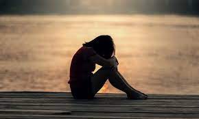 Female athlete feeling despondent and alone in her depressed feelings